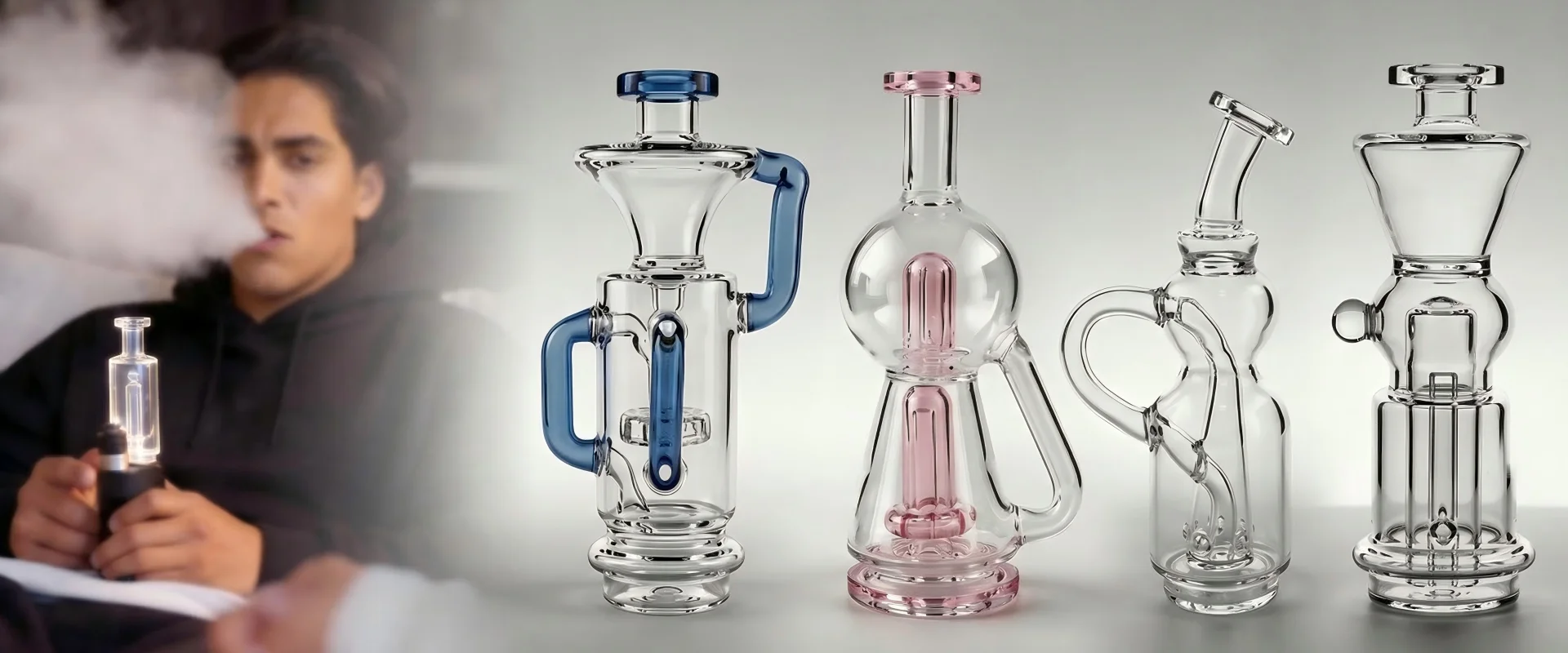 GAB Glass Elite Recycler lineup - Own the Quality Skip the Markup, premium glass at 1/3 market price, blue and pink recyclers with man exhaling vapor