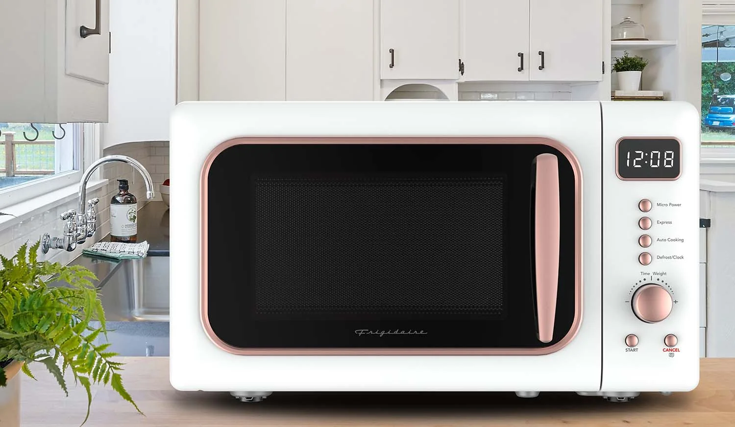 Frigidaire 0.7 Cu. Ft. Retro Countertop Microwave Oven, Black and Gold - Image 14