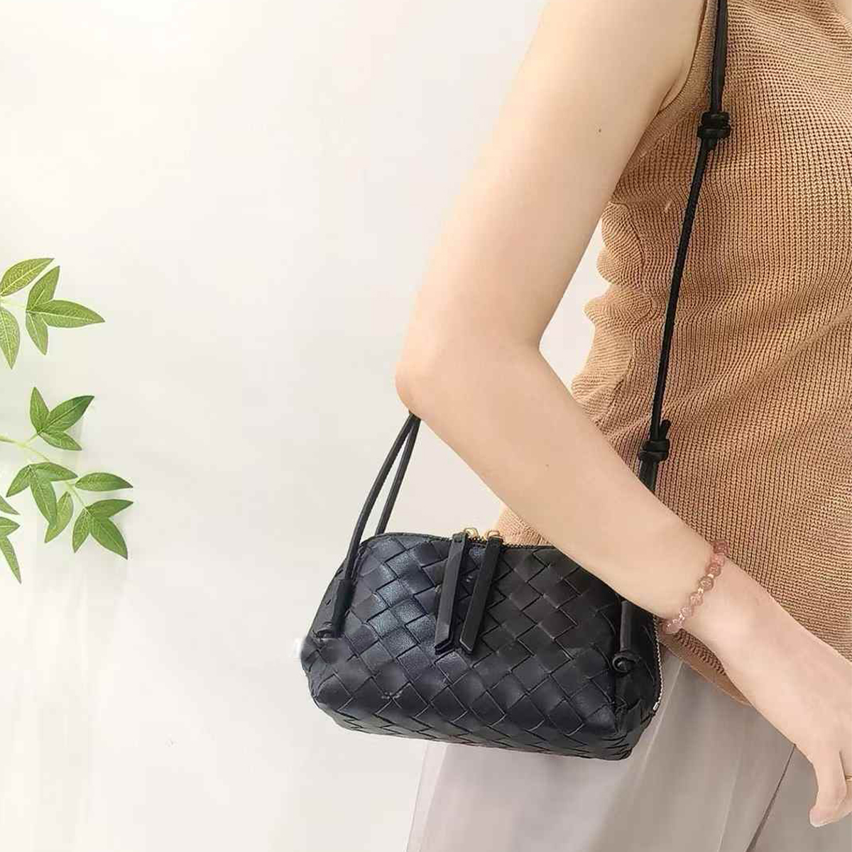 This super cute mini bag from 2026 features a woven long shoulder strap that can be adjusted to fit various carrying styles, such as hand-carry, under-arm bag, or shoulder bag.