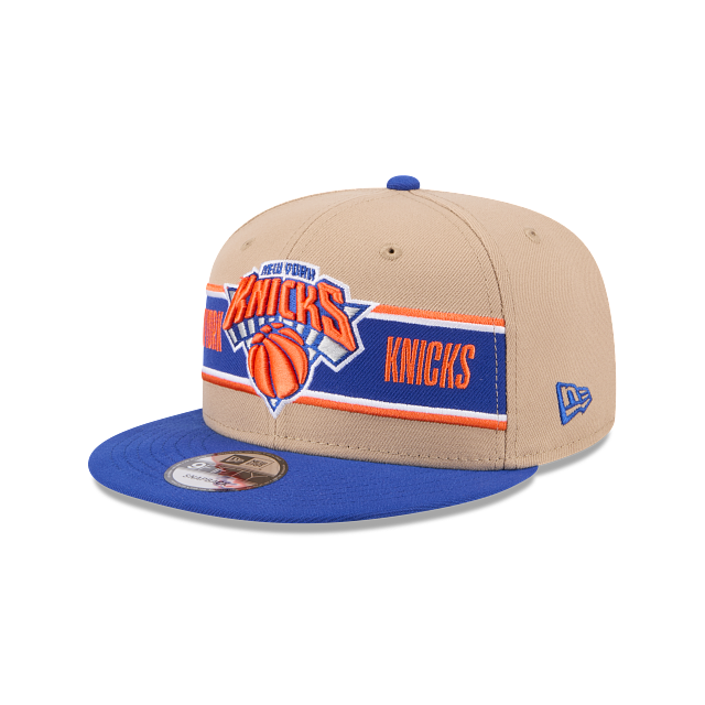 Three-quarter left view of New Era New York Knicks 9FIFTY Snapback Hat showing the blue New Era flag logo embroidered on the side and KNICKS text on the front band