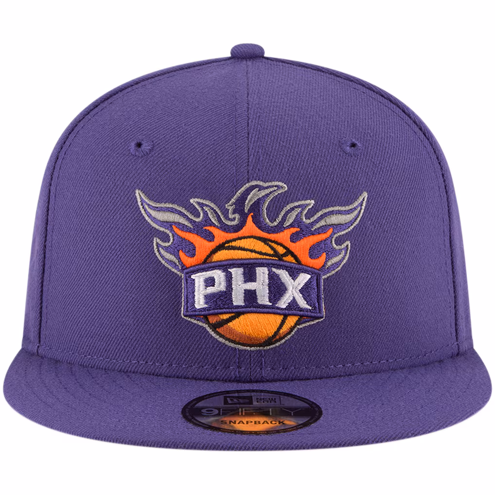 Front view of the Purple Phoenix Suns New Era 9FIFTY Snapback Hat featuring the raised PHX sunburst logo on the crown.
