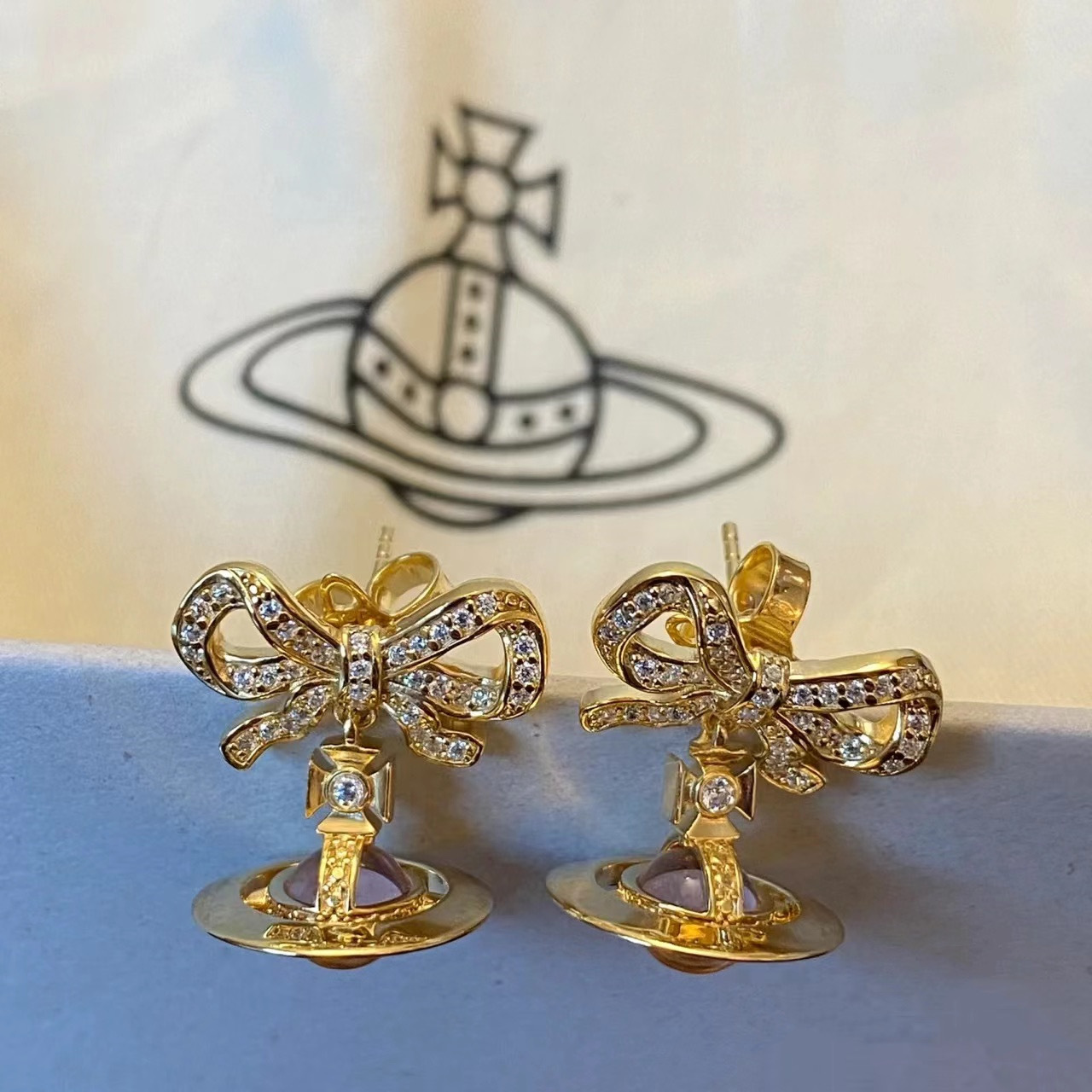 Vivienne Westwood Bowknot Crystal Saturn Earrings - Original Replica Club