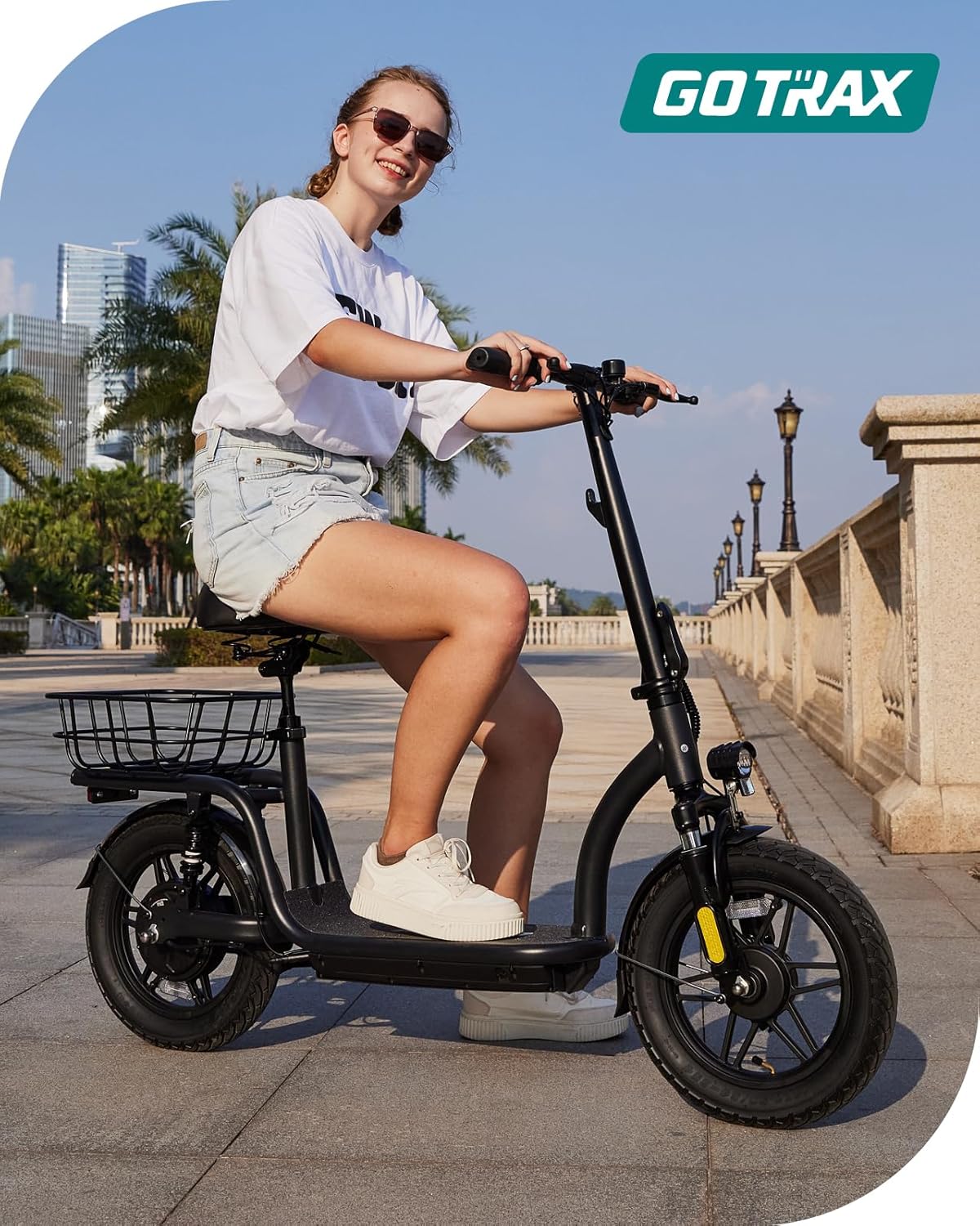 Gotrax adult electric scooter with seat maximum range of 19-25 miles all-terrain tires wide pedals