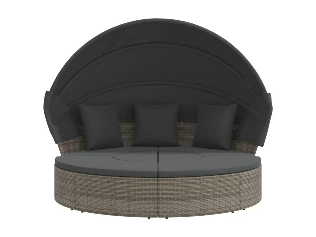 Sofá cama de exterior con dosel y cojines de resina tejida.