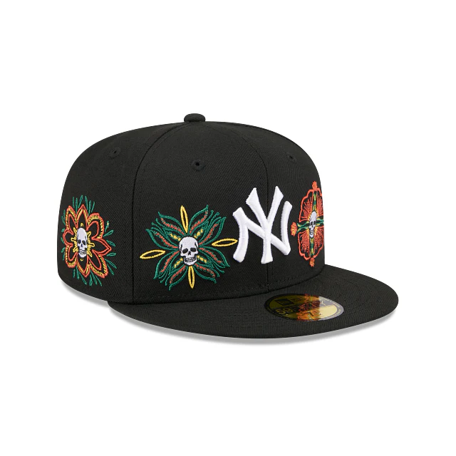 Three-quarter right view of New York Yankees 59FIFTY fitted cap showing white NY logo and colorful skull and flower design.