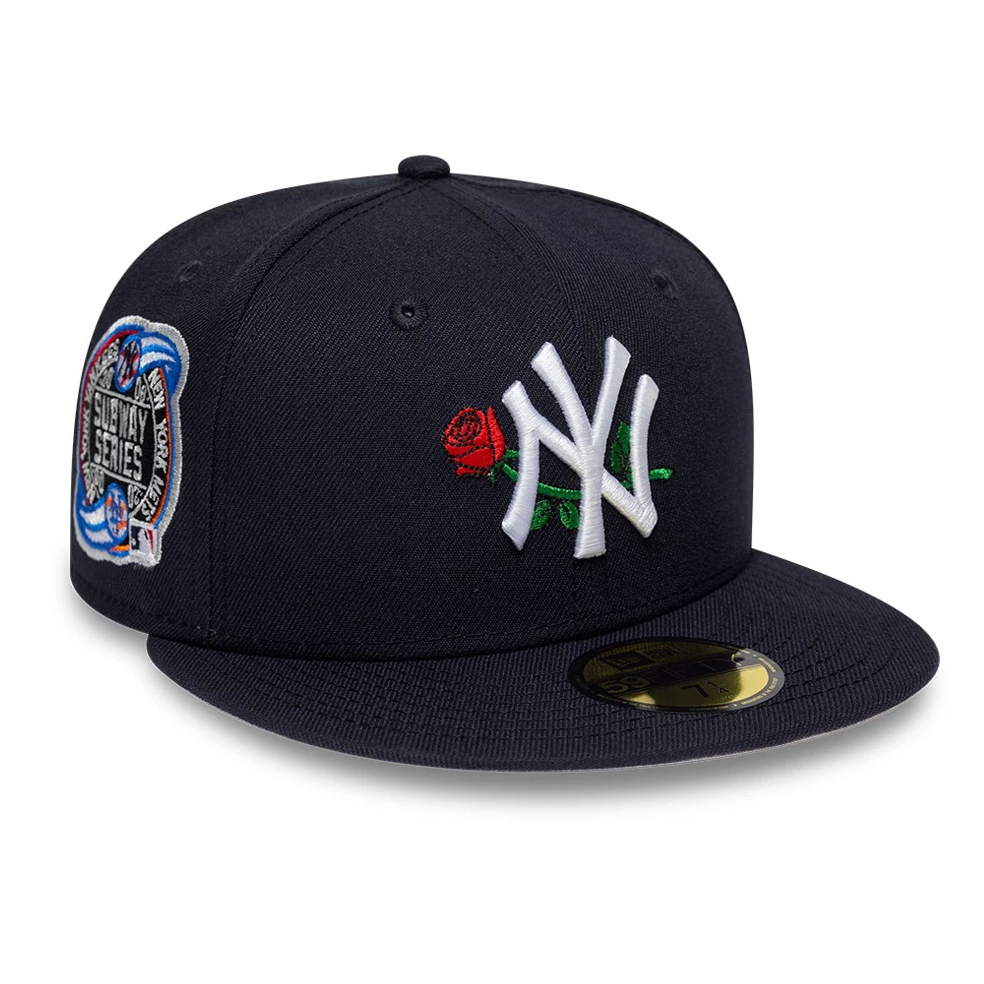 Front view of New York Yankees navy fitted hat highlighting the raised NY logo and red rose design.