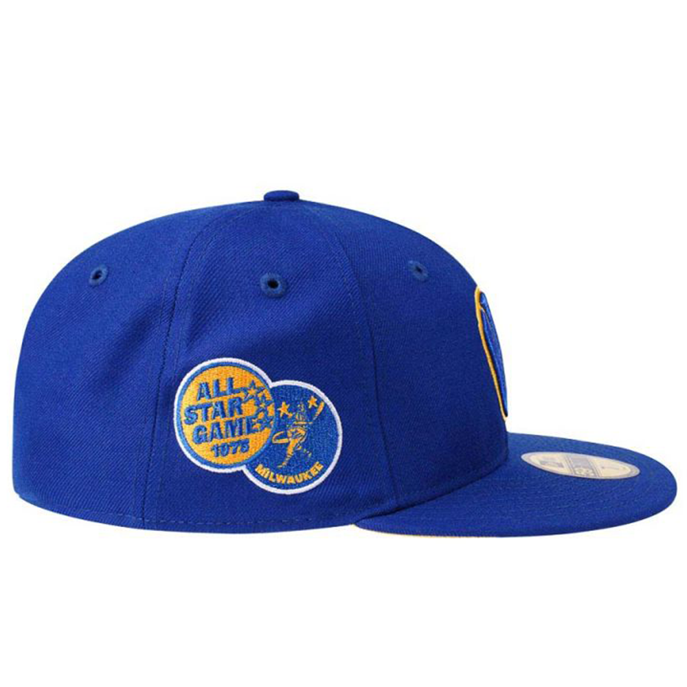 Back view of the New Era Milwaukee Brewers 59FIFTY cap showing the embroidered MLB Batterman logo and a tonal New Era flag on the left side.