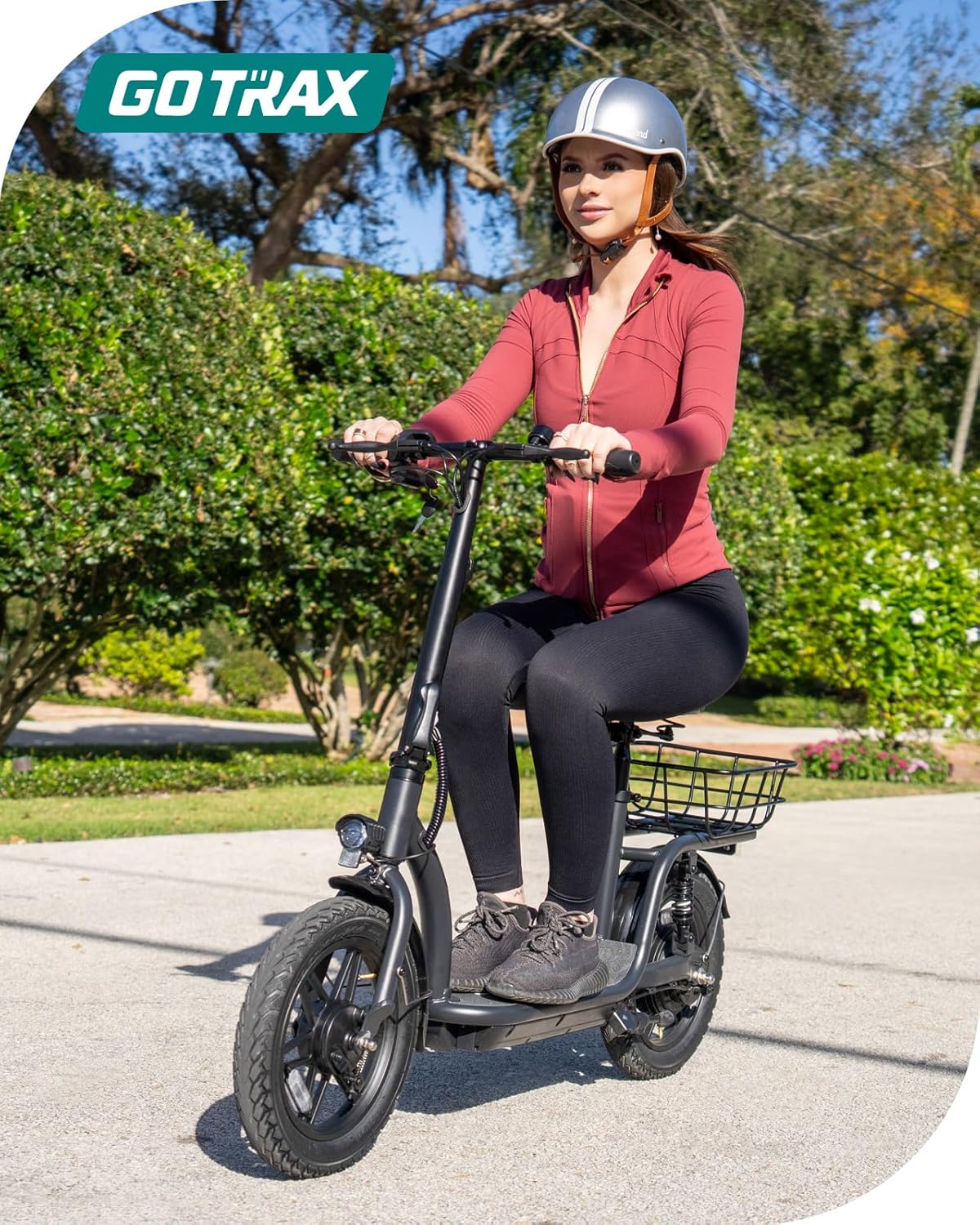 Gotrax adult electric scooter with seat maximum range of 19-25 miles all-terrain tires wide pedals