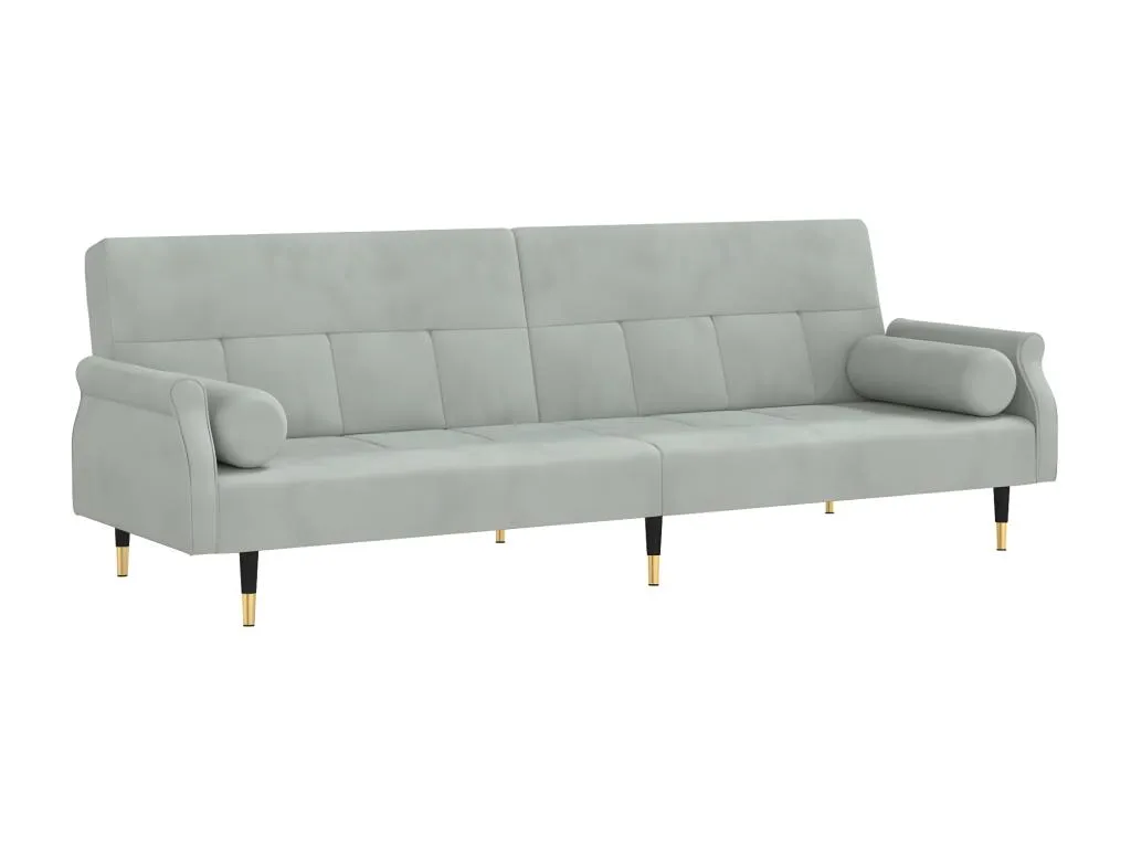 Sofá cama con cojines de terciopelo gris claro.