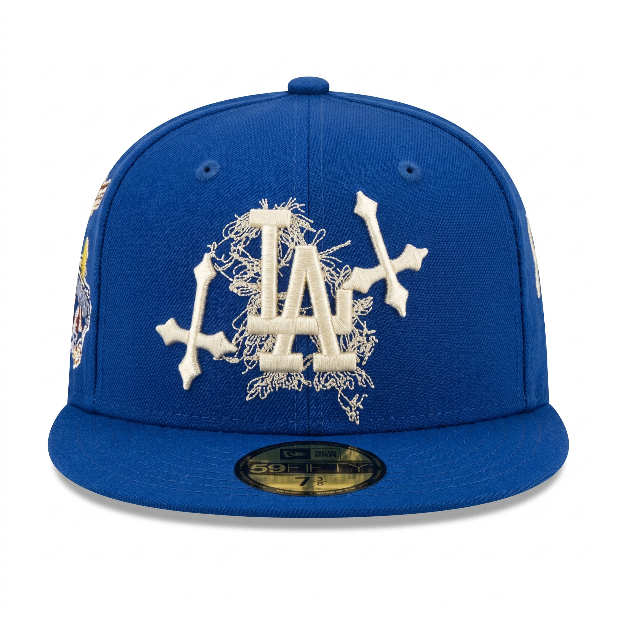 Front view of a Los Angeles Dodgers 59FIFTY fitted hat displaying the white LA logo heavily stylized with cobweb embroidery and gothic crosses.