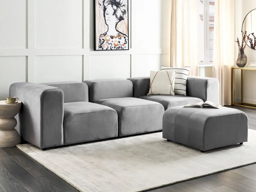 Sofá modular 3 plazas de terciopelo gris con otomana Decoencanto