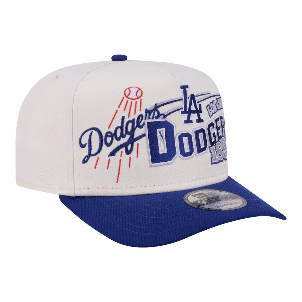 Angled view of the New Era Los Angeles Dodgers Classic A-Frame 9FIFTY Snapback Hat featuring vintage embroidery on a cream crown with a royal blue visor.