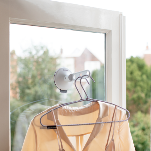 Inklapbare kledinghaak met zuignap