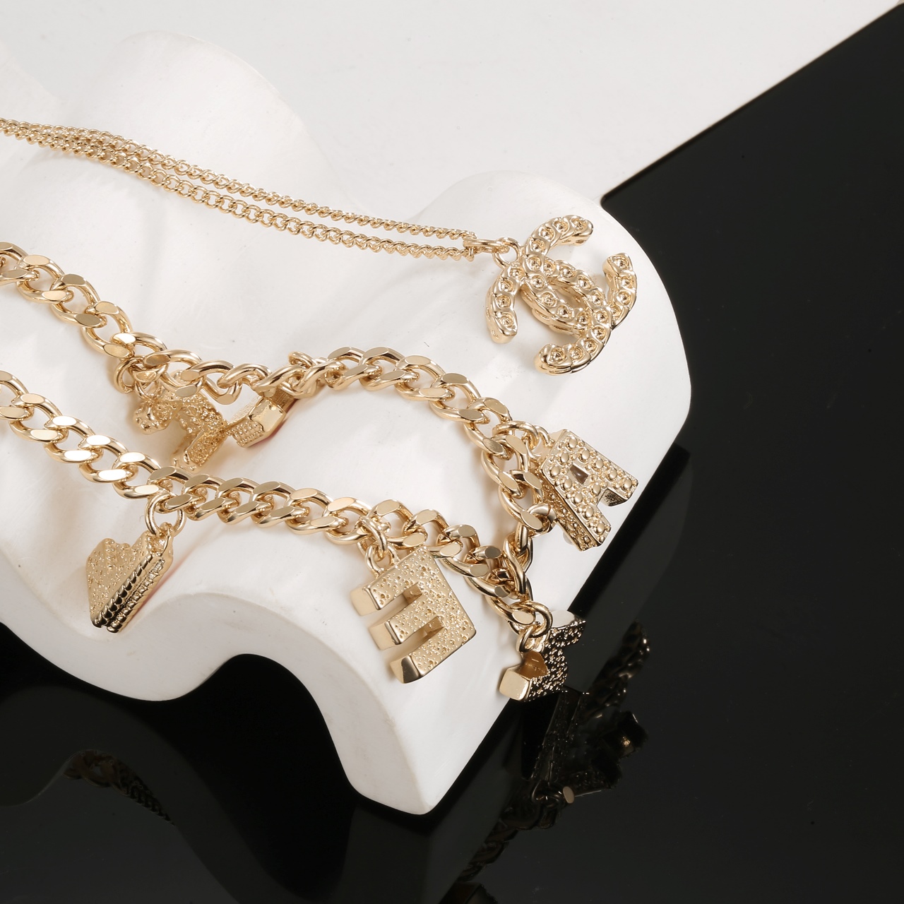 Chanel Multi Layered Light Gold Color Monogram Charms Necklace - Original Replica Club