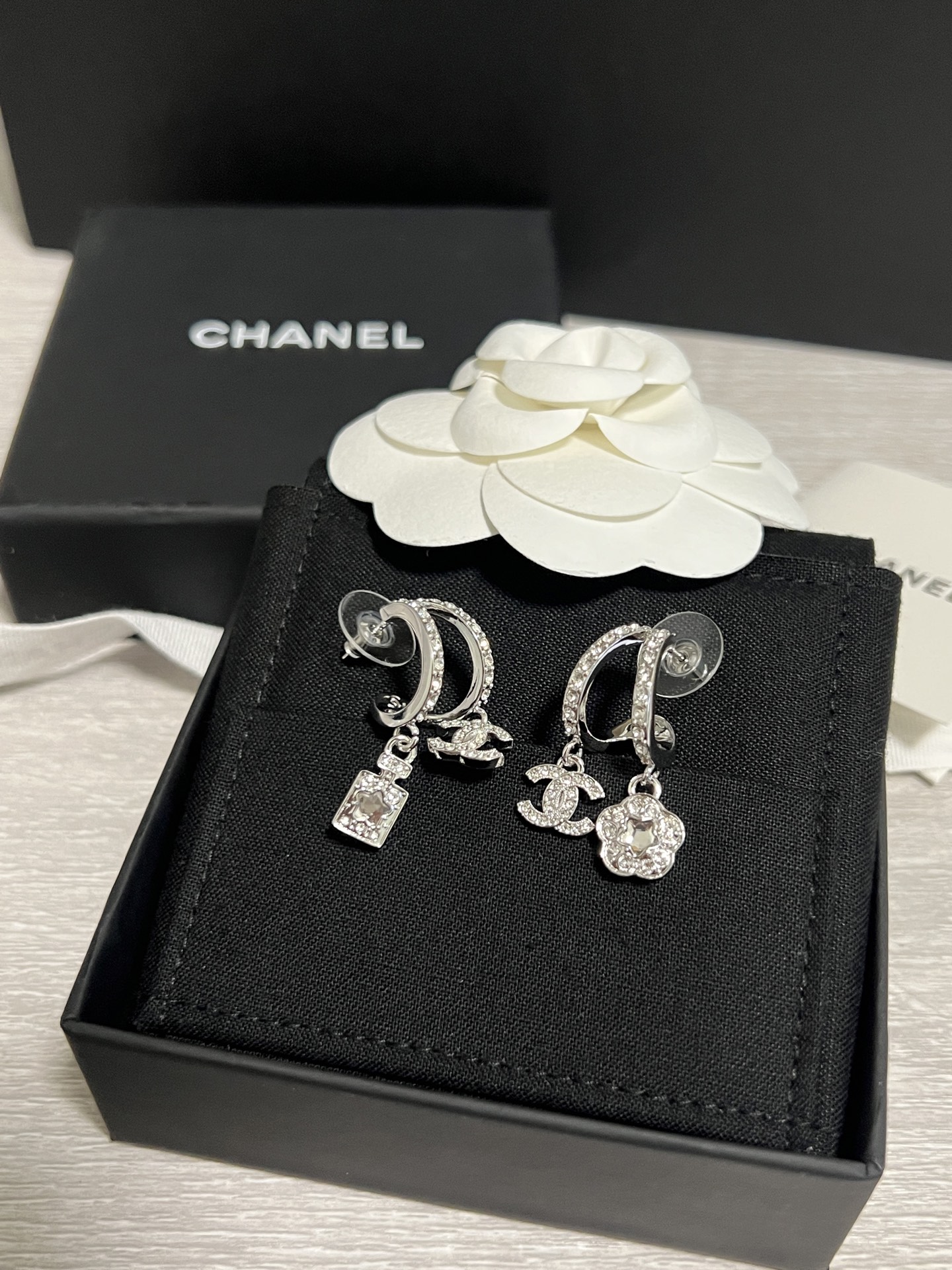 Chanel Asymmetric Silver Earrings with Rhinestone Perfume Bottle Camellia CC Dangle - Original Replica Club