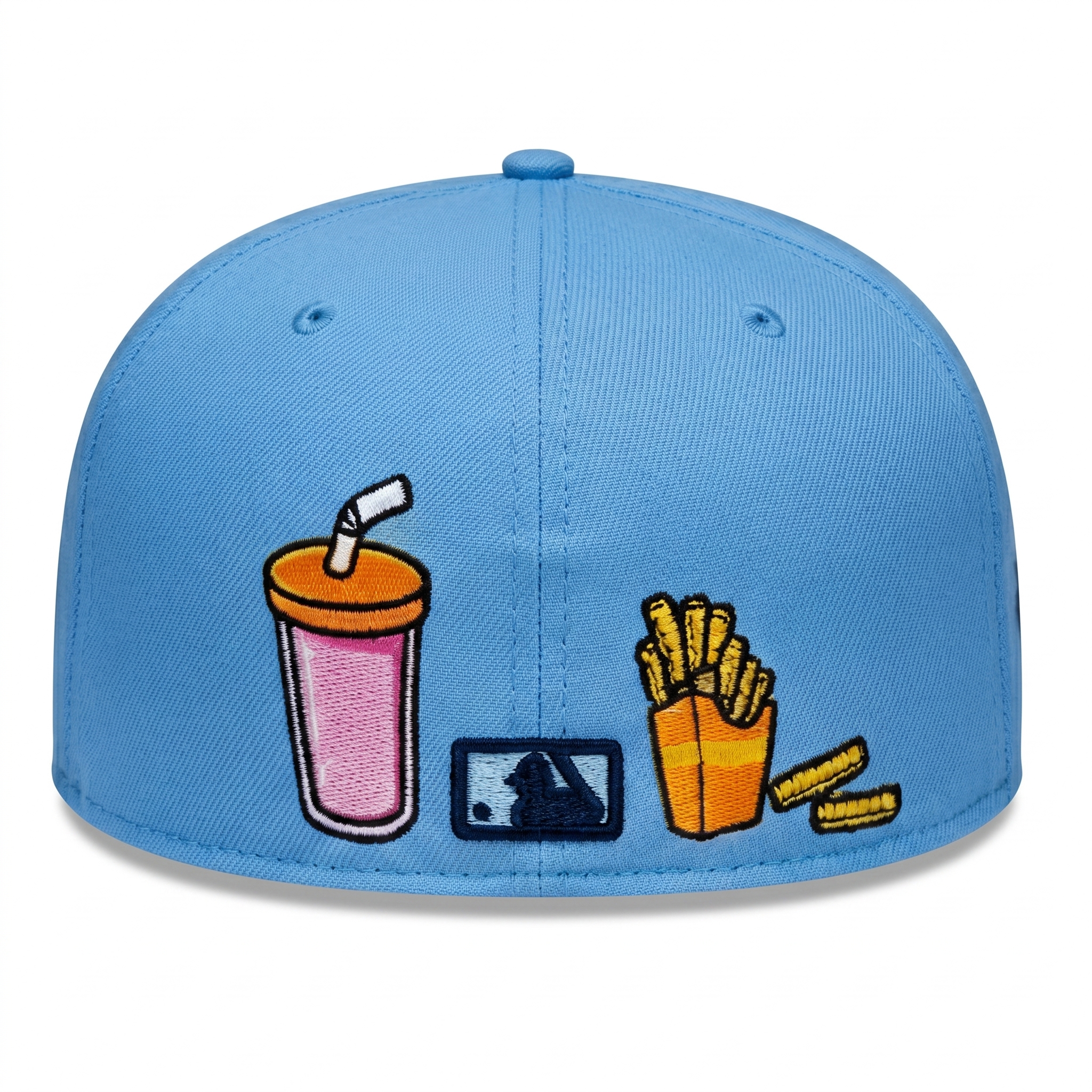 Right side profile of the light blue New York Yankees 59FIFTY fitted hat showing a custom embroidered hamburger patch.