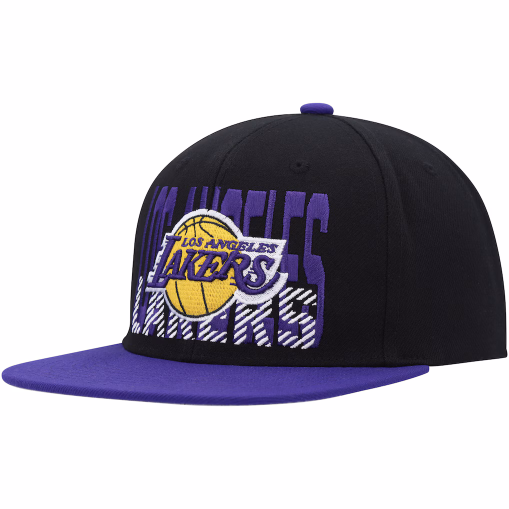 Three-quarter view of the Mitchell & Ness Los Angeles Lakers Soul Cross Check Snapback Hat in black with a purple brim and oversized front graphic.