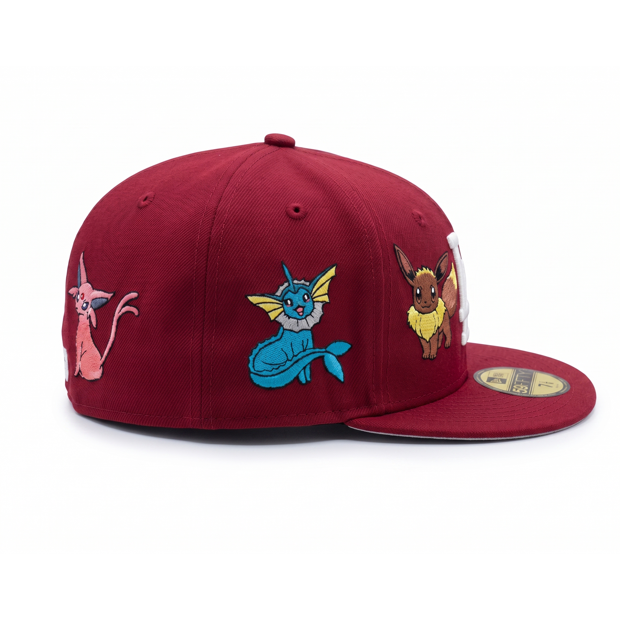 Right side profile of a maroon Los Angeles Dodgers custom Pokémon fitted cap highlighting detailed embroidery of Espeon, Vaporeon, and Eevee