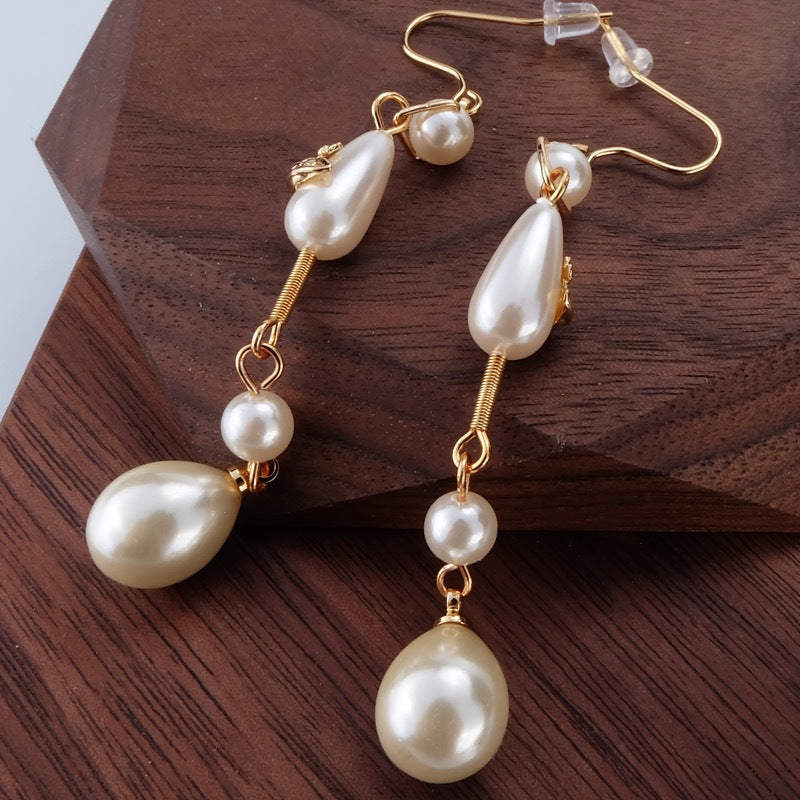 Vivienne Westwood Teardrop Pearl Saturn Earrings - Original Replica Club