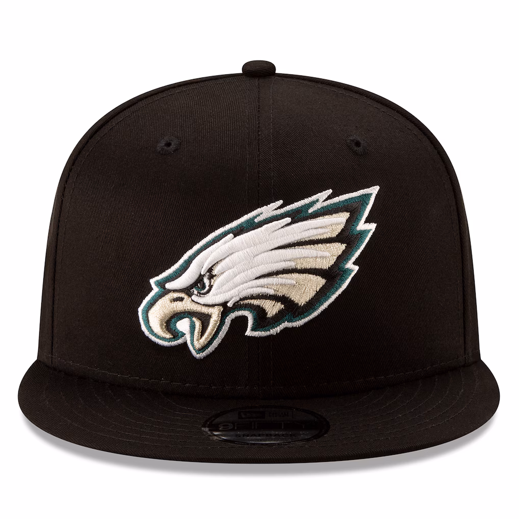 Front view of the all-black Philadelphia Eagles New Era 9FIFTY Snapback Hat displaying the iconic embroidered eagle head primary logo.