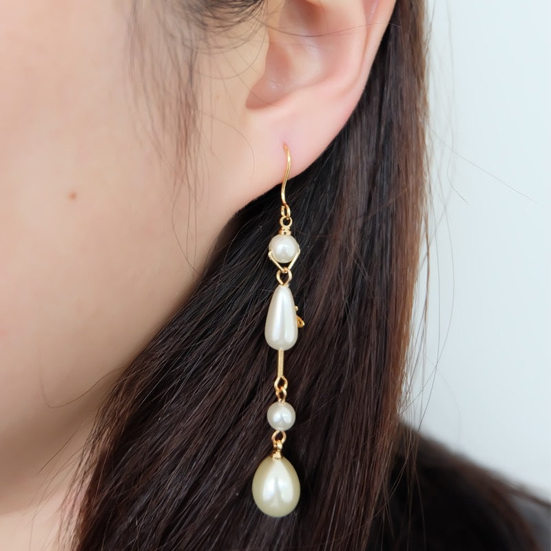 Vivienne Westwood Teardrop Pearl Saturn Earrings - Original Replica Club