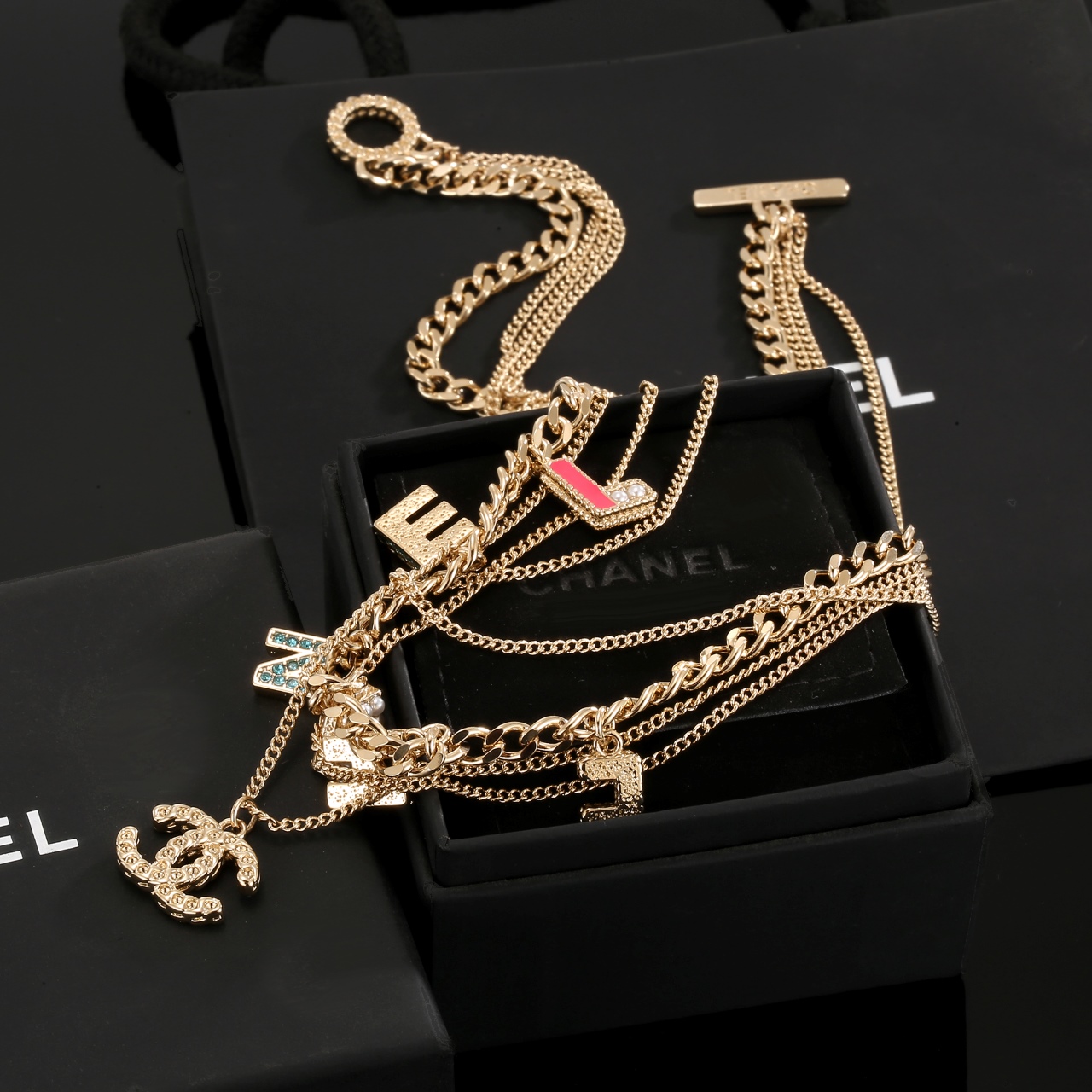 Chanel Multi Layered Light Gold Color Monogram Charms Necklace - Original Replica Club