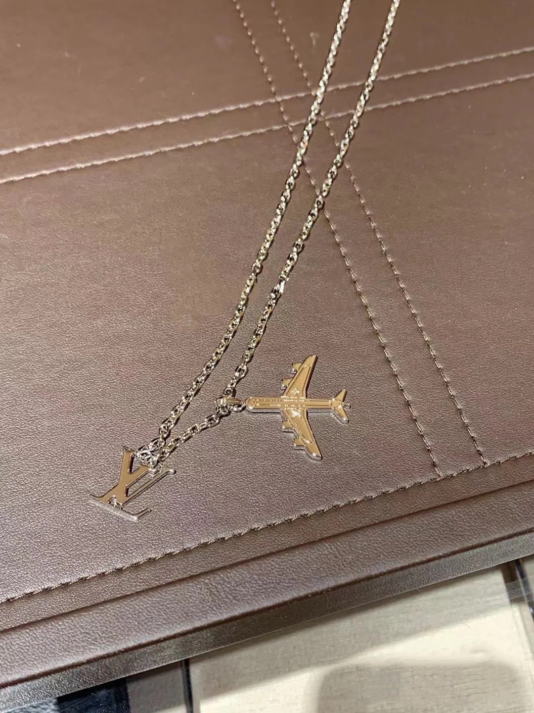 Louis Vuitton Silver LV Plane Mens Necklace - Original Replica Club