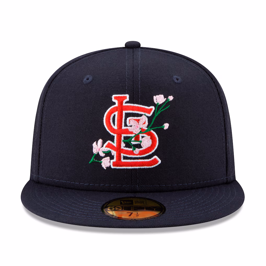 Front view of the St. Louis Cardinals navy fitted hat with pink cherry blossom embroidery around the red StL logo.