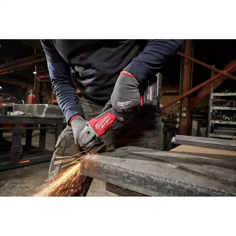 Milwaukee M18 FUEL 18V Brushless 4-1/2 in/5 in Angle Grinder With Paddle Switch - Two 6.0 Ah Batteries and Charger - Image 4 Milwaukee M18 FUEL 18V Brushless 4-1/2 in/5 in Angle Grinder With Paddle Switch - Two 6.0 Ah Batteries and Charger - Image 4