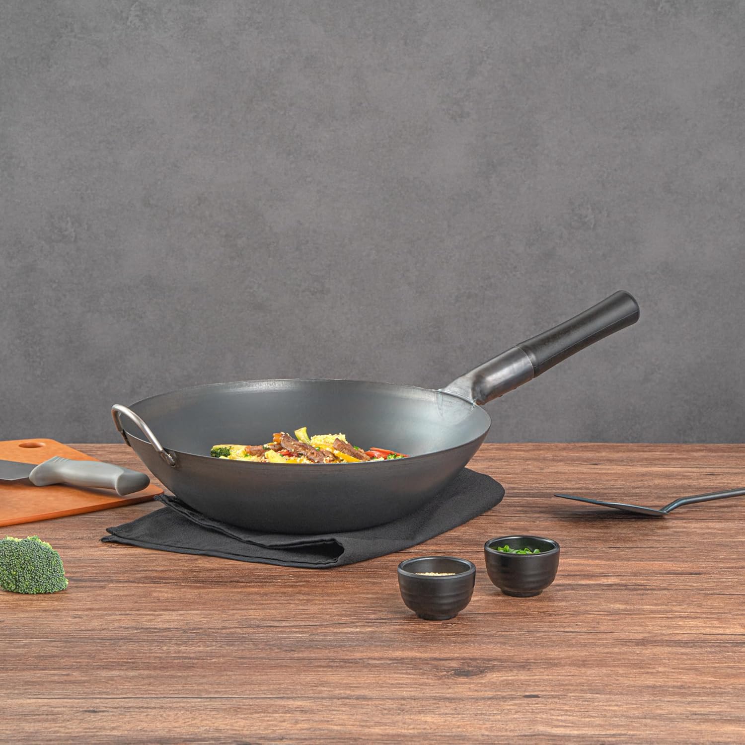 Restaurantware Carbon Steel Wok 1 Pack of 13.3 Inch Heavy-Duty Uniform Heat Distribution Pan Induction Compatible Flat Bottom Wok Welded Handle Black For Gas Stovetops And Grills